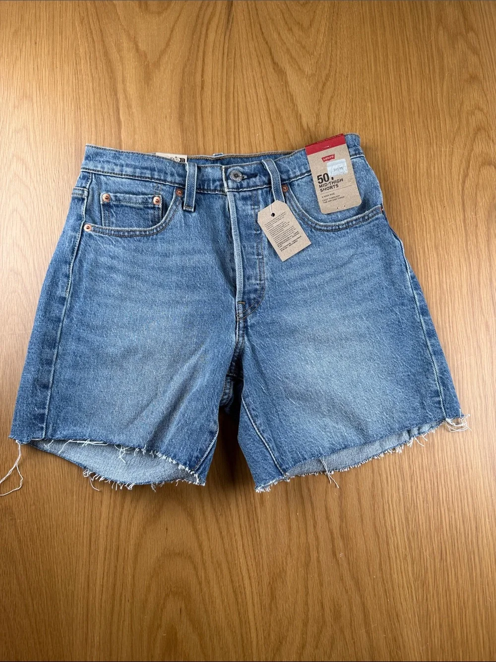 Levi's women’s High-Rise Cutoff Denim Mid-Thigh Shorts 858330074 size 27 - Picture 1 of 6